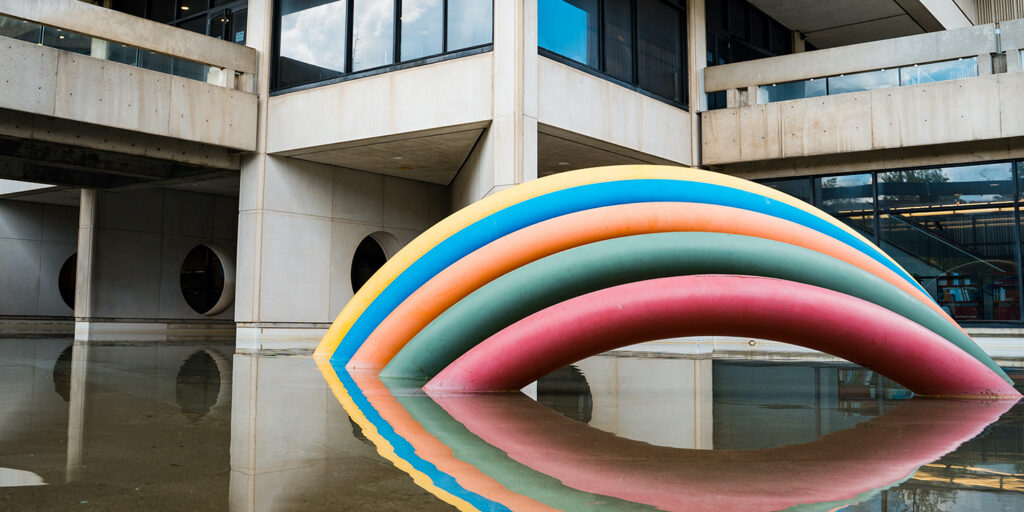 Rainbow sculpture and the exterior of the Scott Library on the Keel campus